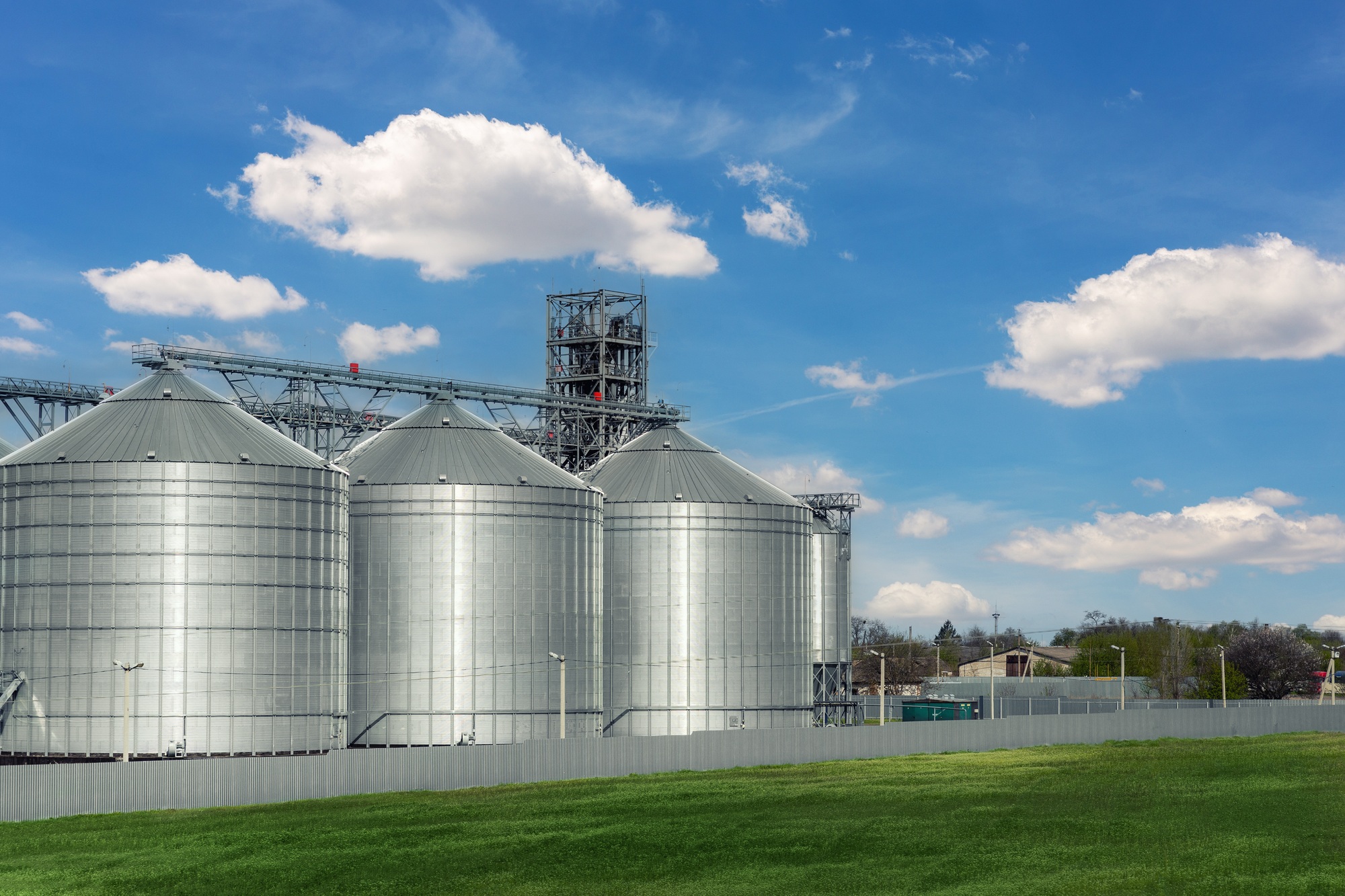 Scenic view of big modern steel agricultural grain granary silos cereal bin storage warehouse